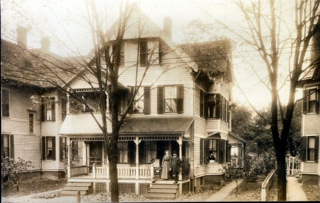 Unknown house with couple on porch