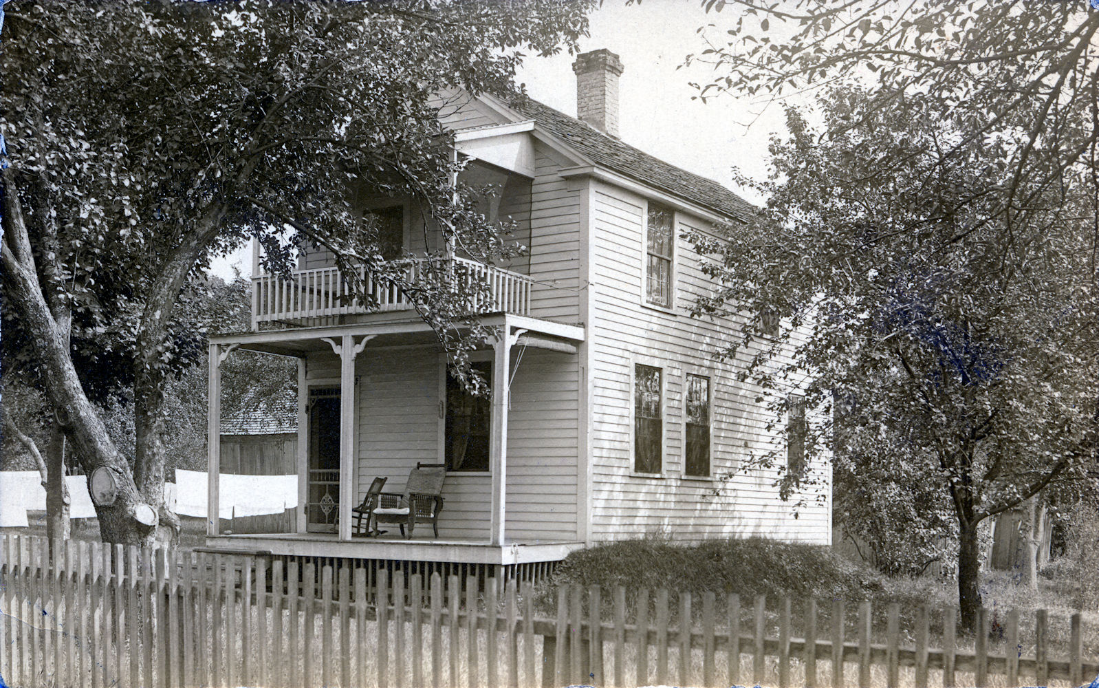 Unknown rural house with Morris chair on porch